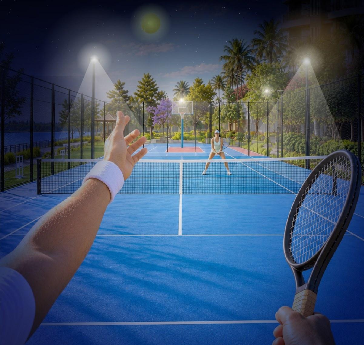 Floodlit tennis court beside the lake at night