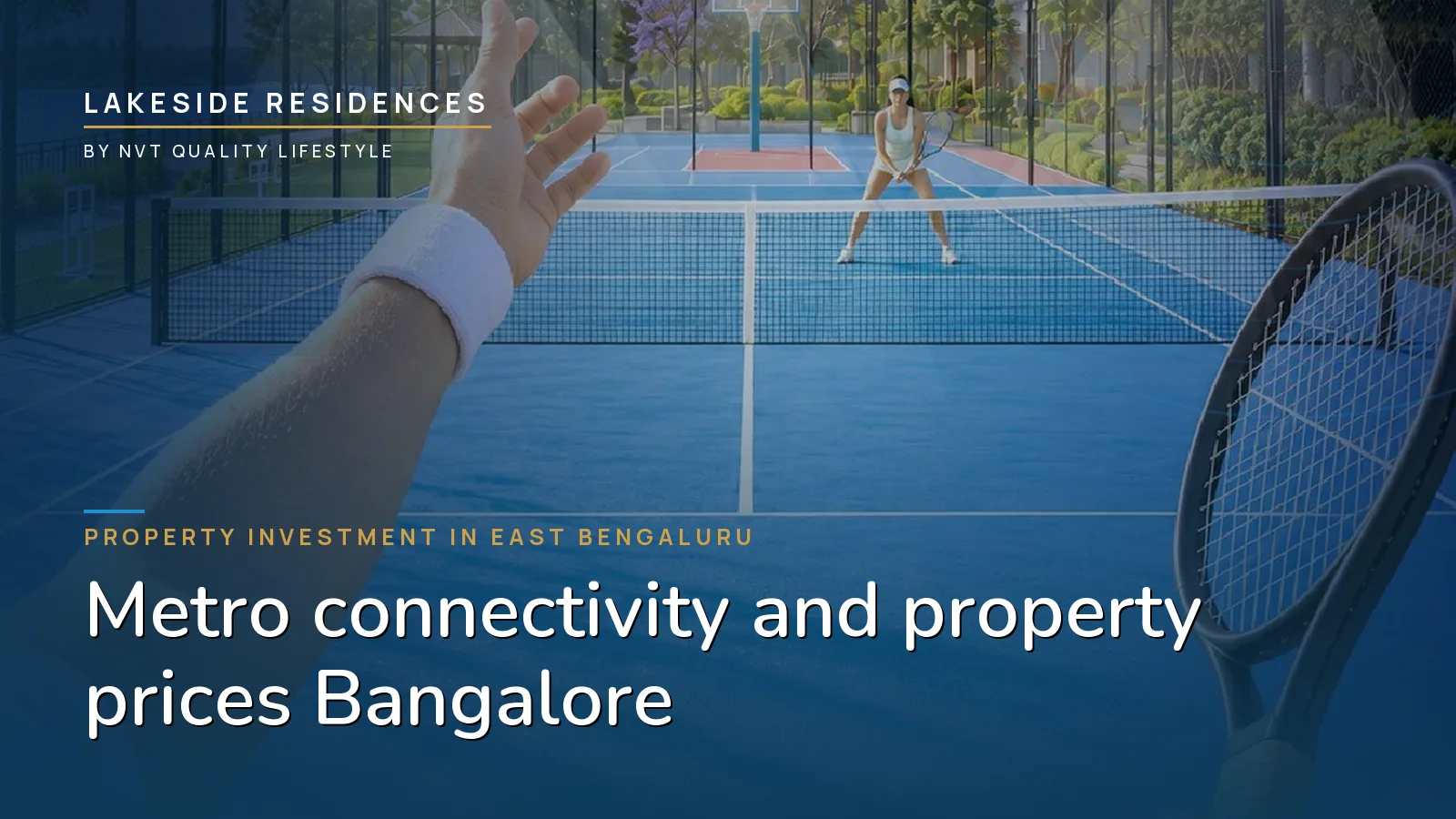 A floodlit tennis court beside the lake at Lakeside Residences in the evening